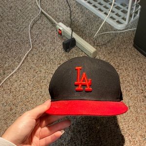 LA red and black hat